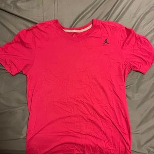 Air Jordan V-neck style tshirt. Color is a dark pink/red  Size M